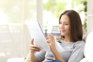 Dayton Home Inspection Woman Calculating Home Budget