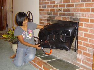 Dayton Home Inspection A Woman holding a fireplace plug
