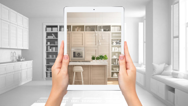 Hands,Holding,Tablet,Showing,Modern,White,And,Wooden,Kitchen,,Total